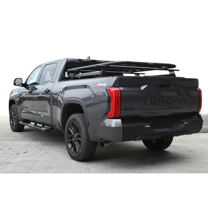 Rear view of gray 2020 GMC truck with XRS cross bars