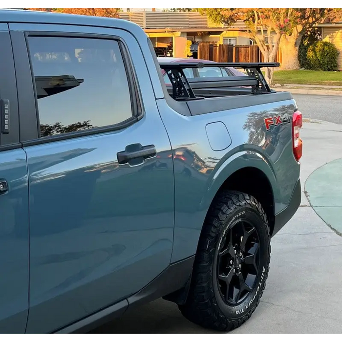 Blue truck in driveway - Go Rhino XRS Cross Bars Kit - Tex. Blk