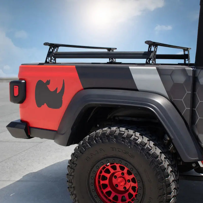 Red and black Jeep with rhino decal on side - Go Rhino XRS Cross Bars Kit - Tex. Blk.