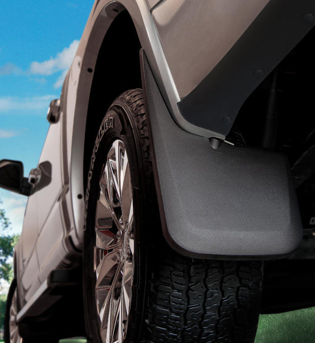 Husky liners custom-molded rear mud guard with tire cover on toyota tacoma