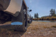 Black car parked on road with husky liners dodge ram 1500/2500 mud flaps