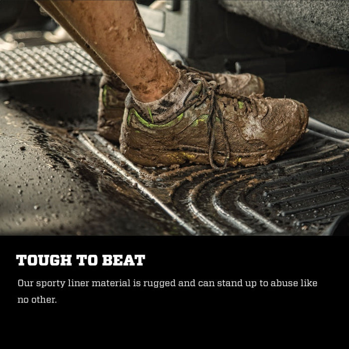 Person applying mud onto a shoe for husky liners weatherbeater front grey floor liners