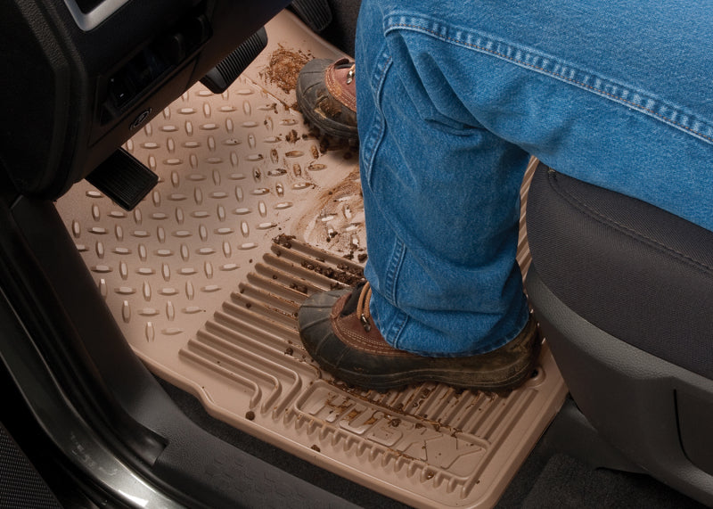 Man standing in back seat of chevrolet silverado extended cab pickup truck