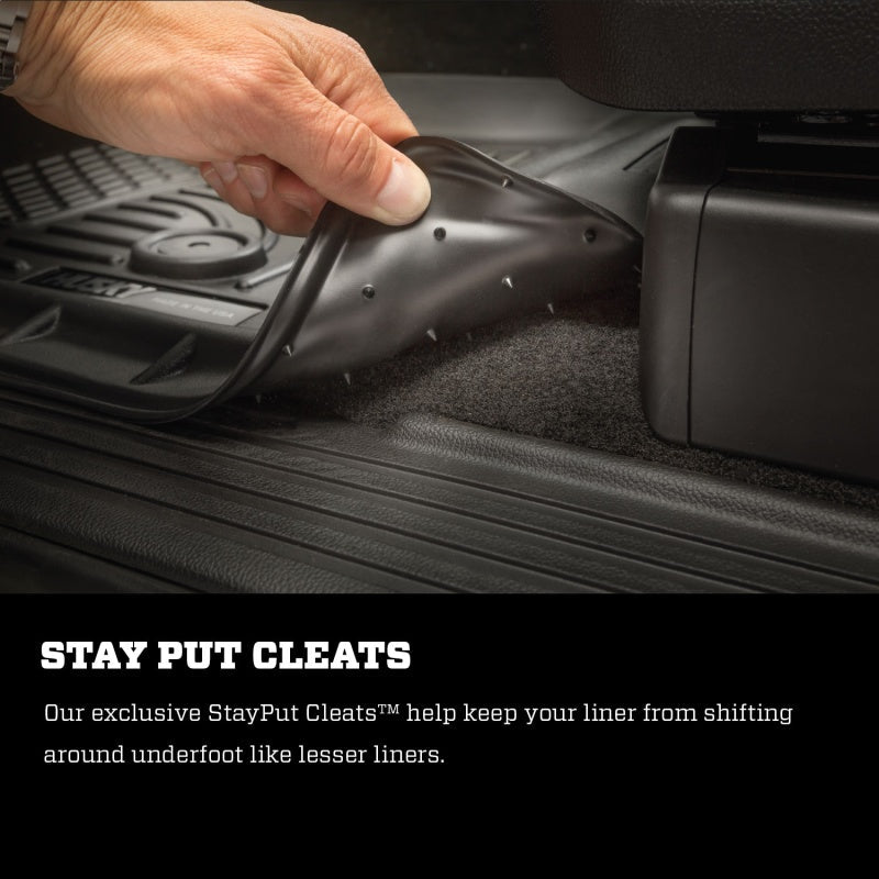 Hand putting weatherbeater floor liner in trunk of a jeep grand cherokee