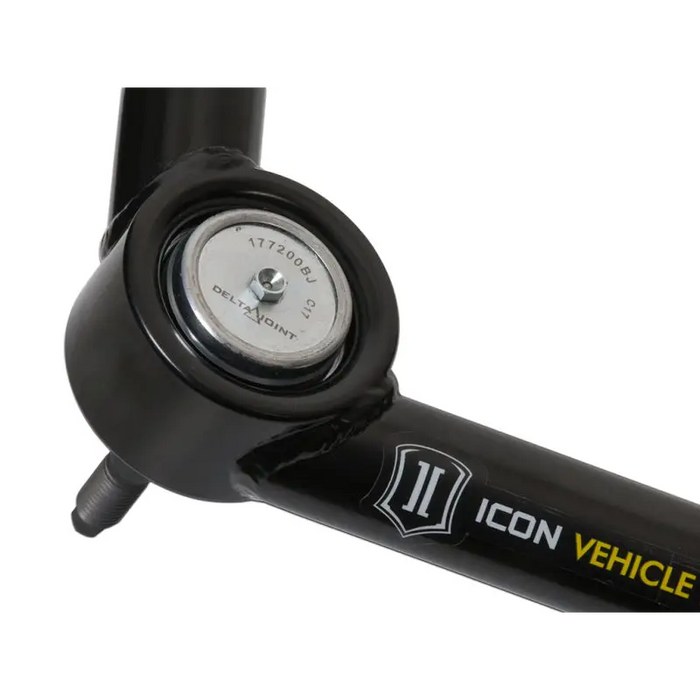 Black bike front wheel mounted on ICON Delta Joint Kit for Toyota Tacoma, Tundra, Nissan Titan XD, and GM 1500.