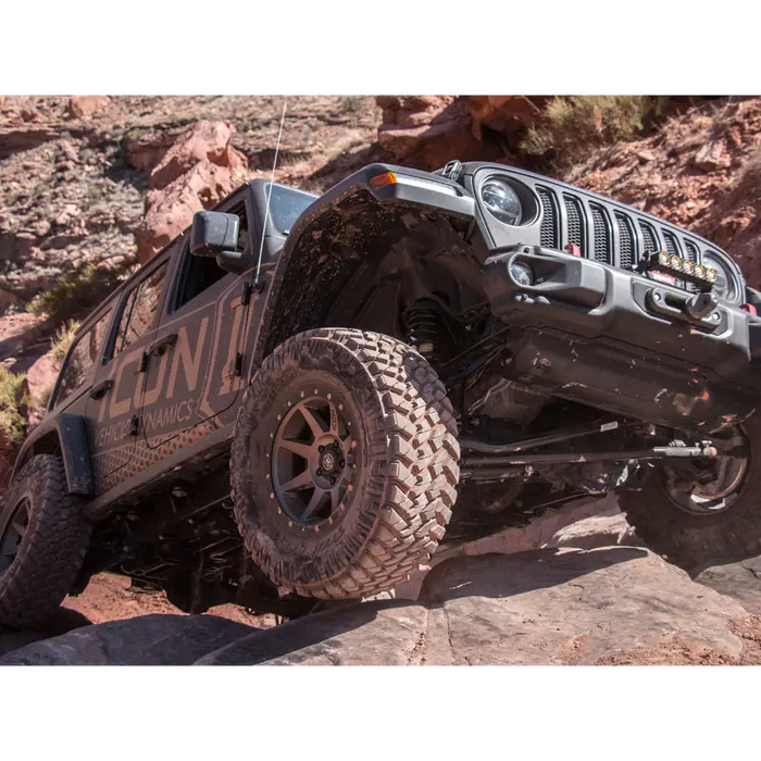 ICON 2018+ Jeep Wrangler JL 2.5in Stage 3 Suspension System driving on rocks.
