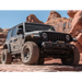 2018+ Jeep Wrangler JL with 2.5in Stage 3 Suspension System on rocky road.
