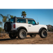 White Ford Bronco with black tire cover - ICON 2021+ 3in Lift C/O Spacer Kit.