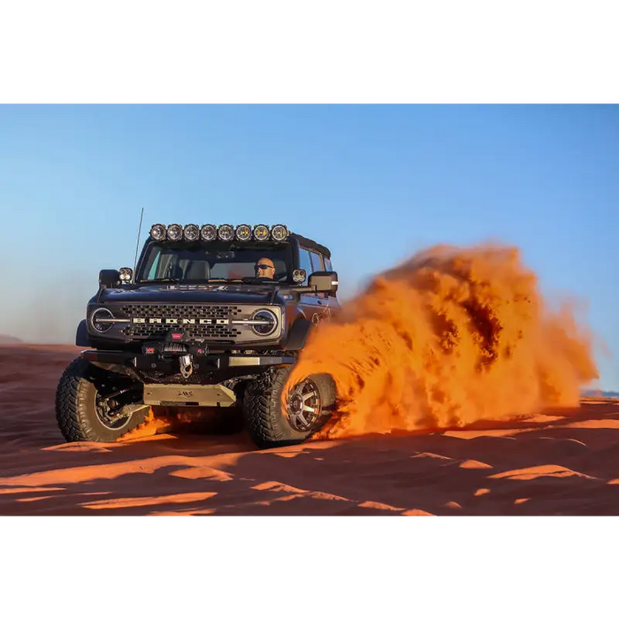 Black truck driving through desert, ICON 2021+ Ford Bronco tie rod kit.