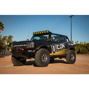Black truck with yellow and black decal on it, ICON 21+ Ford Bronco Tubular Upper Control Arm Delta Joint Kit.
