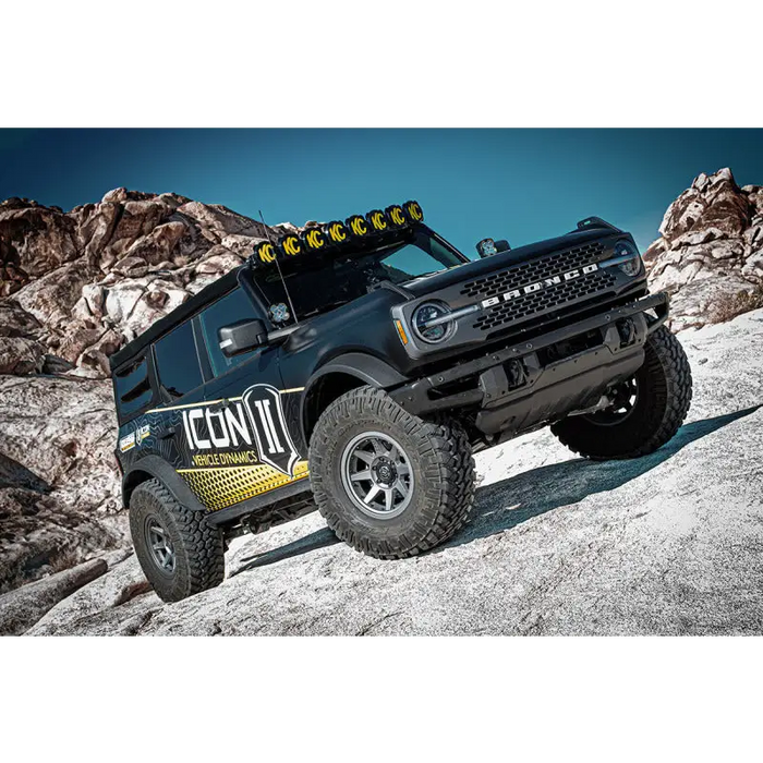 Close-up of a Jeep with light bar, part of ICON 21-UP Ford Bronco coilover kit.