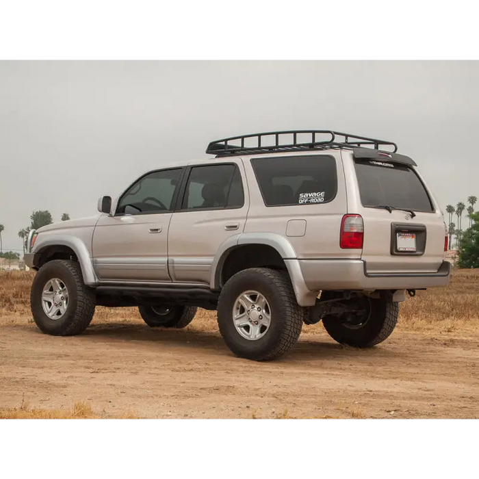 Silver toyota 4runner suv parked on dirt road