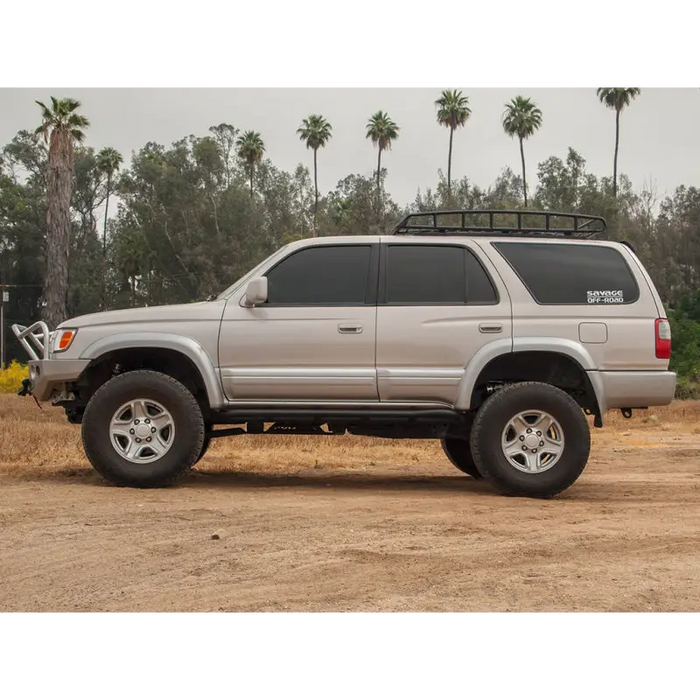 Silver toyota pickup truck parked in field with icon 96-02 4runner stage 1 suspension system