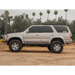 Silver toyota pickup truck parked in field with icon 96-02 4runner stage 1 suspension system