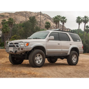 Silver toyota suv parked on dirt road, part of icon 96-02 toyota 4runner stage 3 suspension system.
