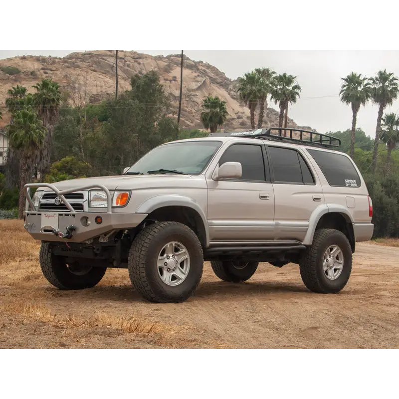 Silver toyota suv parked on dirt road, part of icon 96-02 toyota 4runner stage 3 suspension system.