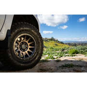 White truck with black rim and wheel featuring ICON Compression 17x8.5 6x5.5 0mm Offset 4.75in BS