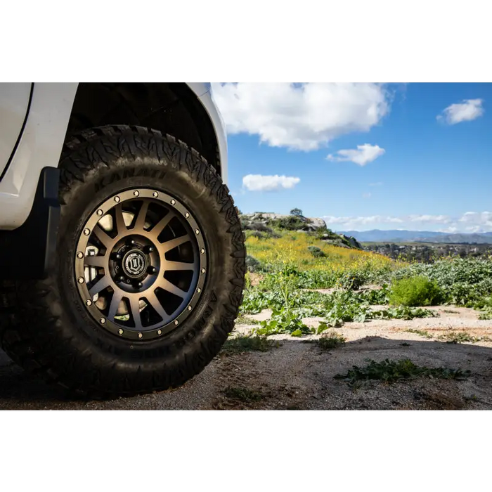 White truck with black rim and wheel featuring ICON Compression 17x8.5 6x5.5 0mm Offset 4.75in BS