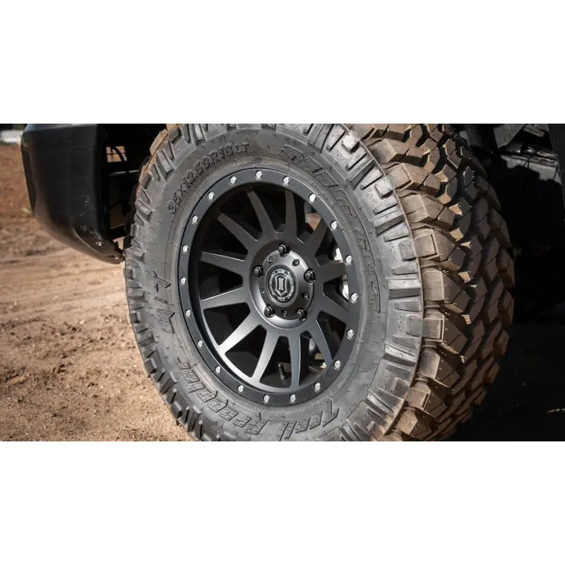 ICON Compression 18x9 Wheel: Front view of truck tire in satin black with 0mm offset