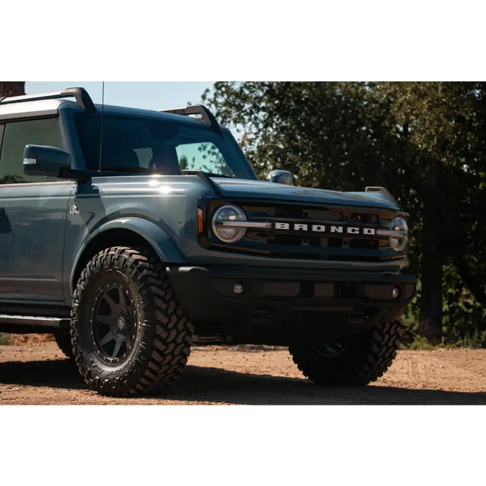 Blue truck parked on dirt road, ICON Rebound 17x8.5 6x5.5 25mm Offset Satin Black Wheel