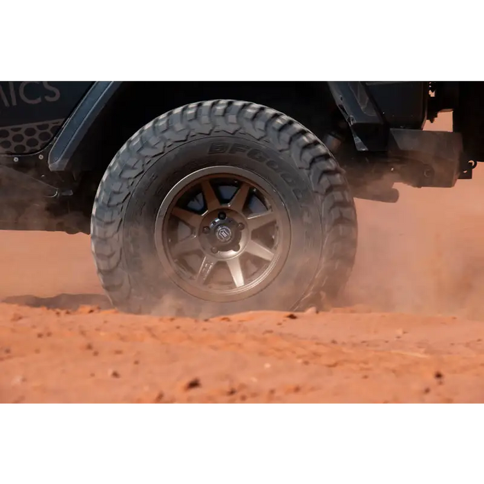 Black Jeep driving through desert with ICON Rebound Pro 17x8 wheel.