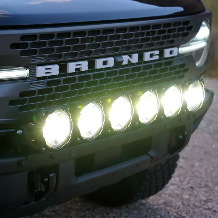 Black truck with lights on - KC HiLiTES 21+ Ford Bronco 39in Gravity LED Pro6 Light Bar Kit Front Bumper