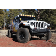 Jeep with light bar covered by KC HiLiTES 6in. Round Soft Covers in Black w/Yellow Logo