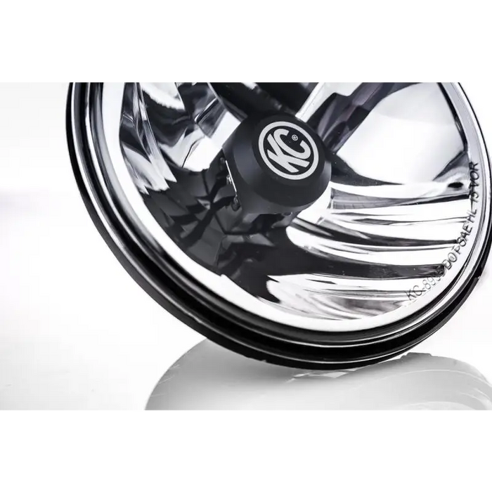 Black wheel with chrome spokes on KC HiLiTES 7in. Gravity LED H4 DOT Approved Replac. Headlight