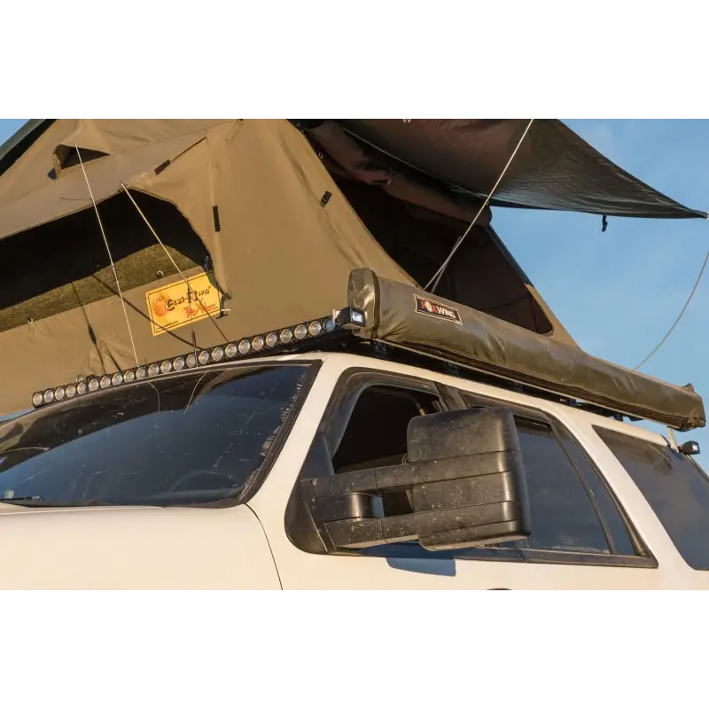 Roof tent attached to car with KC HiLiTES C-Series C2 LED 2in. Backup area flood light pair pack.