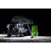 Man sitting in van at night under KC HiLiTES C-Series C2 LED 2in. Area flood light - pair pack, black.