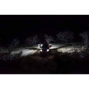 Car parked at night with KC HiLiTES C-Series C2 LED 2in. Backup Area Flood Lights (Pair Pack) in Black - heat sink design