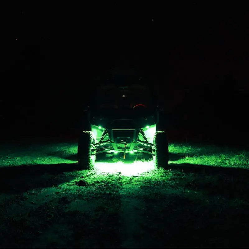 KC HiLiTES Cyclone V2 LED - Green Lens driving through dark forest