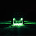 KC HiLiTES Cyclone V2 LED - Green Lens driving through dark forest