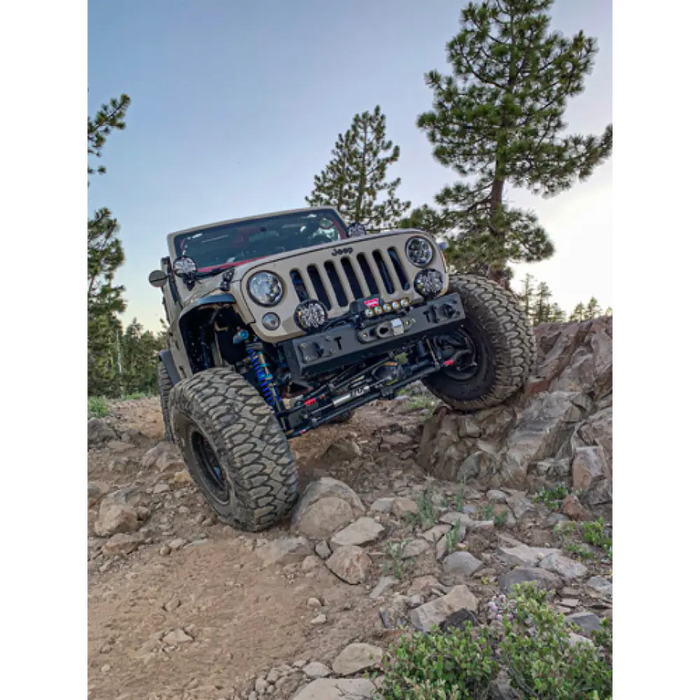 Jeep driving down rocky trail with SlimLite® LED lights