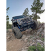 Jeep driving down rocky trail with SlimLite® LED lights