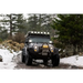 Jeep driving on snowy road with KC HiLiTES SlimLite 6in. LED lights