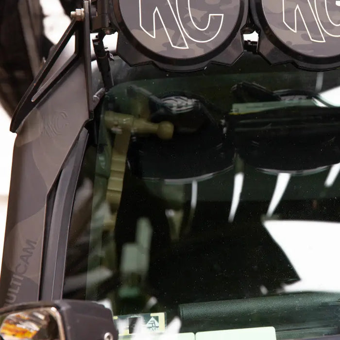 Close up of a car with number on it - KC HiLiTES Universal Wire Hider.