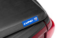 Lund hard fold tonneau cover on red and blue toyota tacoma truck bed