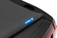Black lund hard fold tonneau cover on red toyota tacoma with blue label