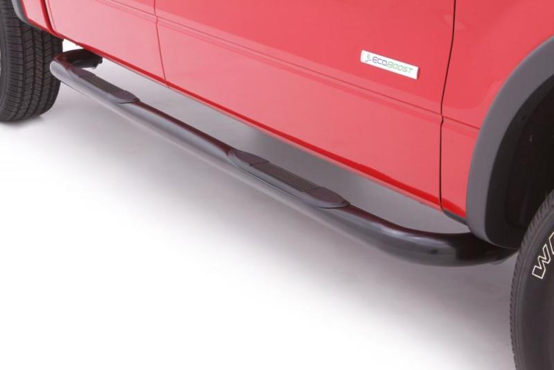 Red truck with lund steel nerf bars in black on toyota tacoma access cab