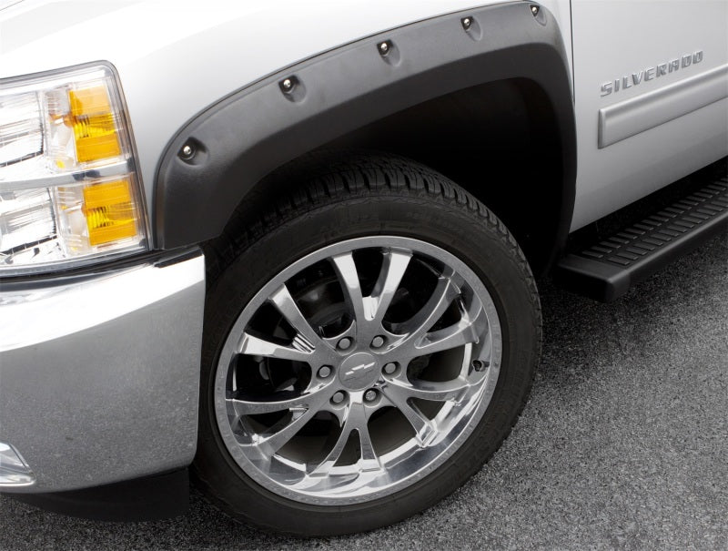 White truck with black rim and tire, featuring lund’s rx-rivet style fender flares for toyota tacoma
