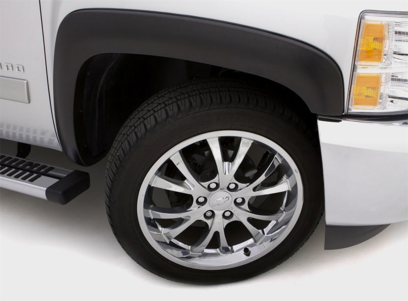 White truck with black rim and chrome wheels displaying lund 16-17 toyota tacoma sx-sport style fender flares