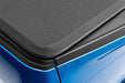 Blue car with black seat pad - lund genesis elite tri-fold tonneau cover for toyota tacoma