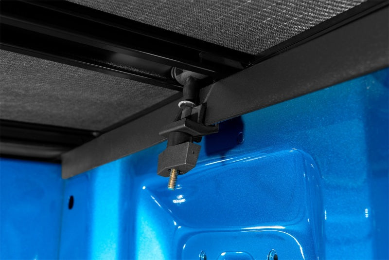 Genesis elite tri-fold tonneau cover latch detail on blue door