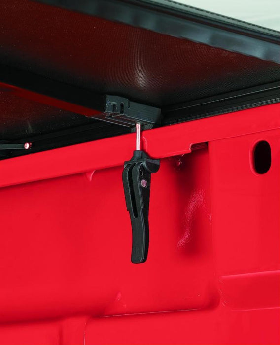 Red tool box with black handle - lund 16-23 toyota tacoma genesis elite tri-fold tonneau cover