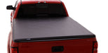 Black lund 16-23 toyota tacoma hard fold tonneau cover - truck with bed on back