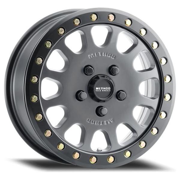 Method mr401 utv beadlock titanium wheel in matte black and gold on white background