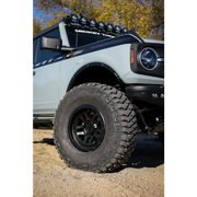 White truck with black tire cover featuring Mickey Thompson Baja Legend MTZ Tire - 35X12.50R17LT 119Q.