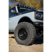 White truck with black tire cover featuring Mickey Thompson Baja Legend MTZ Tire.