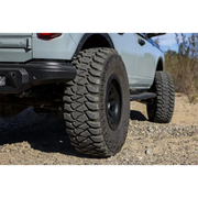 Silver truck with large tire featuring Mickey Thompson Baja Legend MTZ Tire - 37X12.50R17LT 124Q